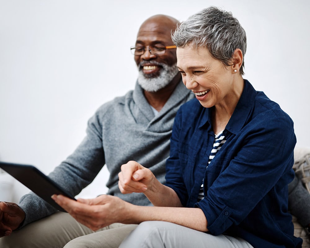 senior couple mixed race laughing